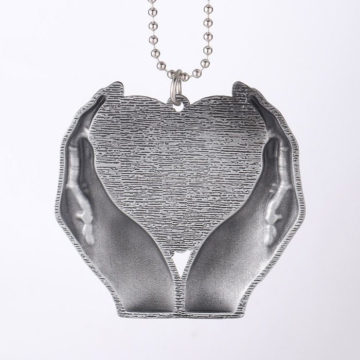Sublimation holding a heart-shaped Pendant Gift